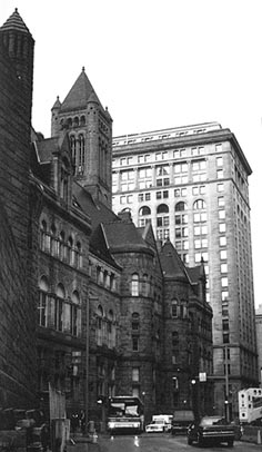 The Courthouse reflected in the Frick Building.