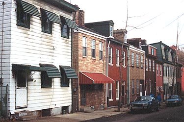 These rowhouses have suffered from every siding fad.