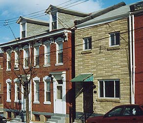 Perfectly preserved houses mingle with horribly mangled ones.